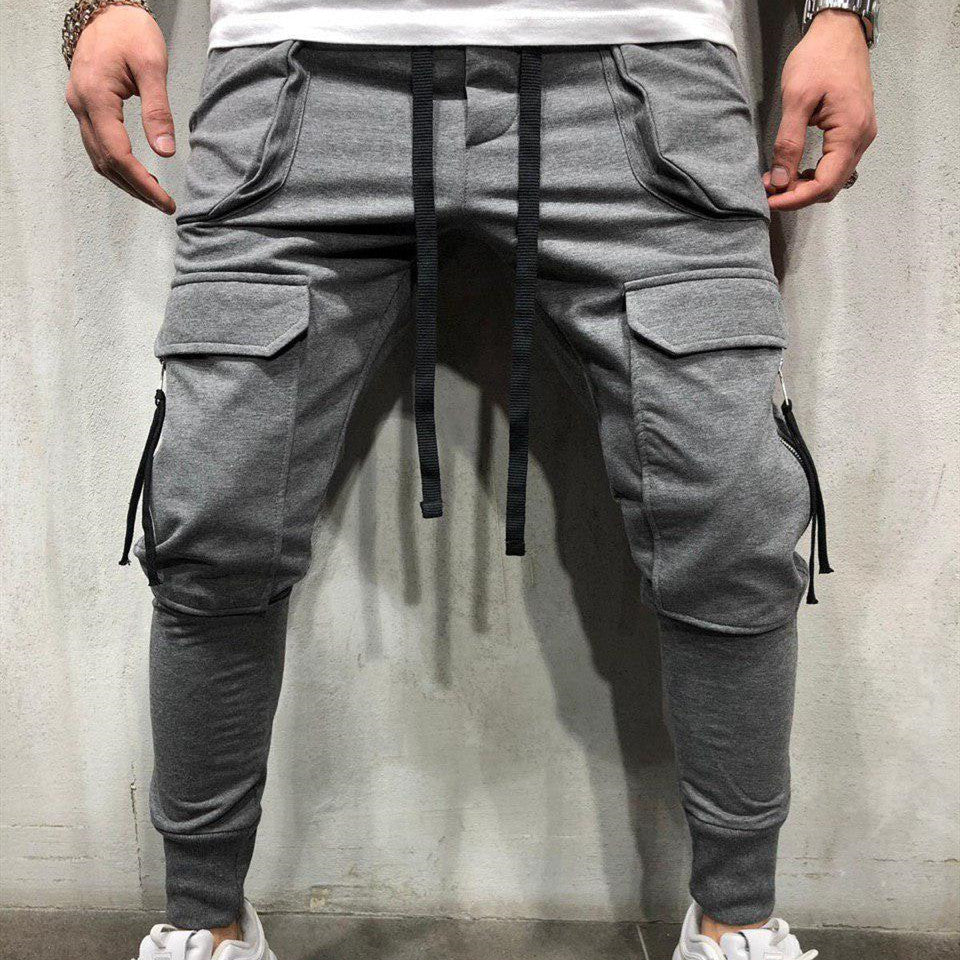 Slim-fit track pants with zipper patch pockets